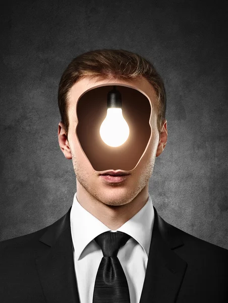 Man with bulb inside head — Stock Photo, Image