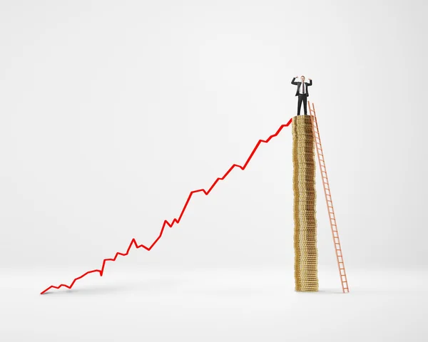 Businessman on pole of coins and diagram — Stock Photo, Image