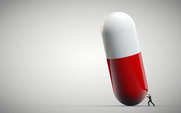 Orvosi rámenős ember tablettát elkülönített fehér háttér — Stock Fotó