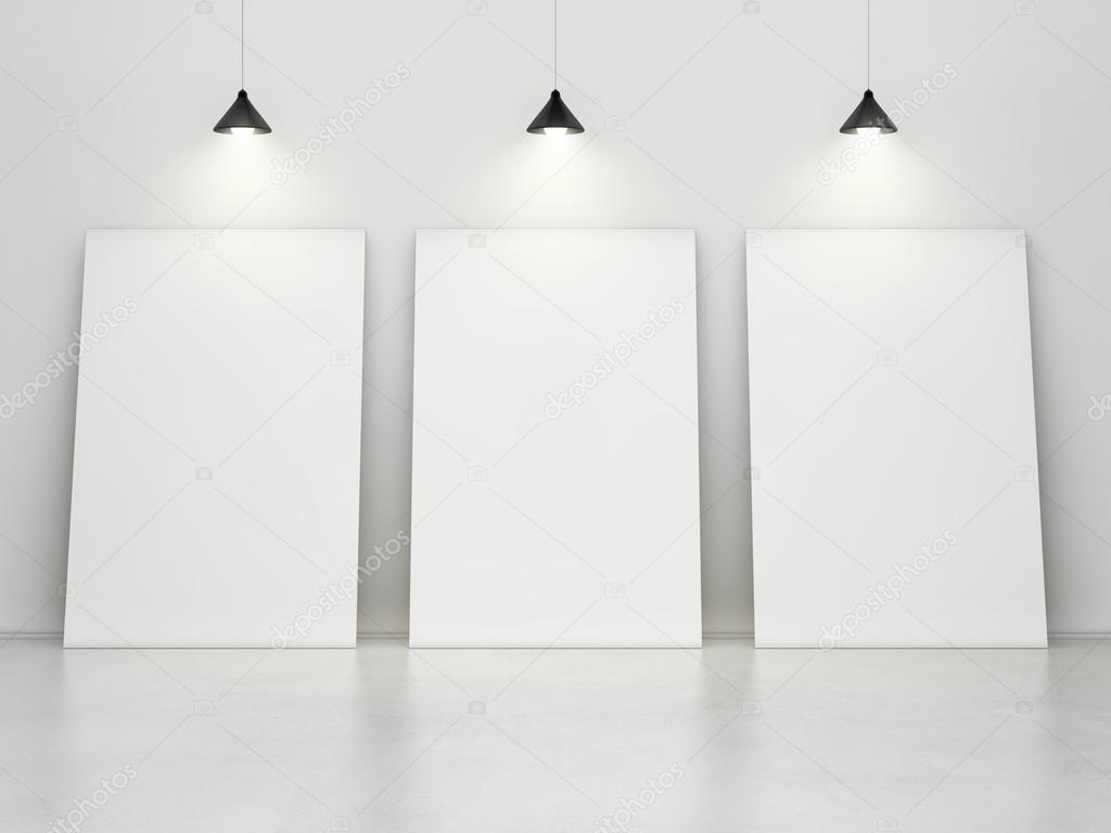 white room with posters on wall and lamps