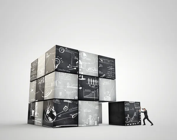 The geometrical image cubes with business strategy. Businessman moves an enormous weight — Stock Photo, Image