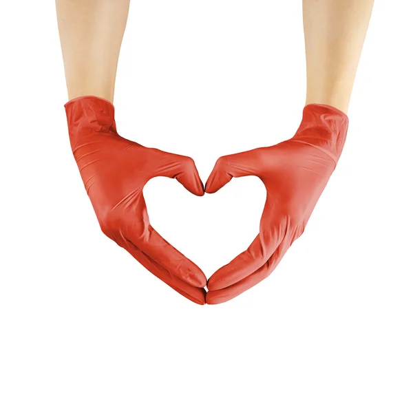 Las manos en forma de corazón en guantes de medicina roja —  Fotos de Stock