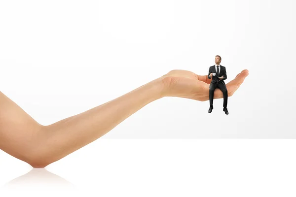 Businessman sitting and drinking coffee in a woman hand — Stock Photo, Image