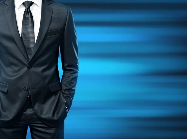 Man in the suit on blue background — Stock Photo, Image