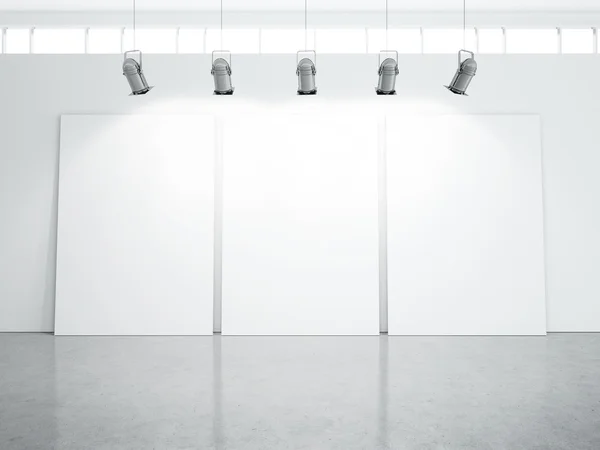 Three blank posters on white wall — Stock Photo, Image