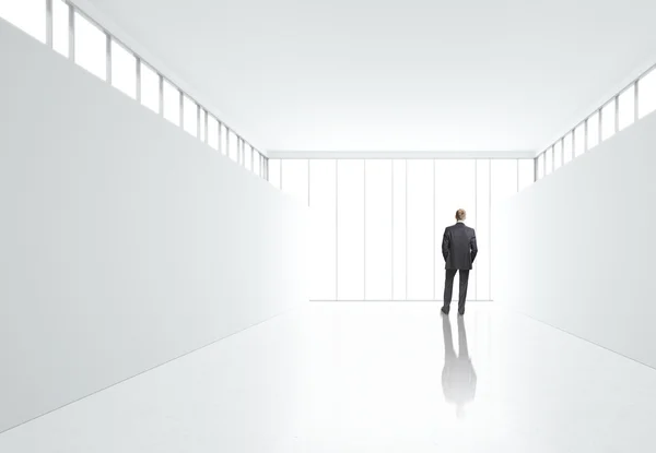 Businessman looking at the wall — Stock Photo, Image