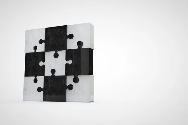 Jigsaw puzzle gemaakt van heldere en donkere stenen stukken — Stockfoto