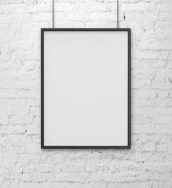 Blank frame on white brick wall
