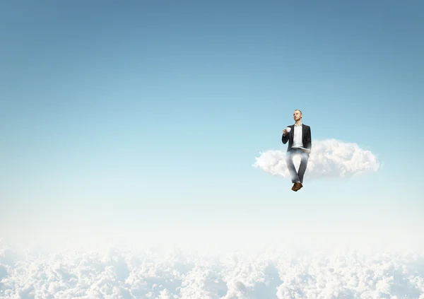 Hombre en una nube con taza de café — Foto de Stock