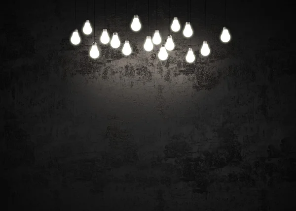 Light bulbs in a dark room — Stock Photo, Image
