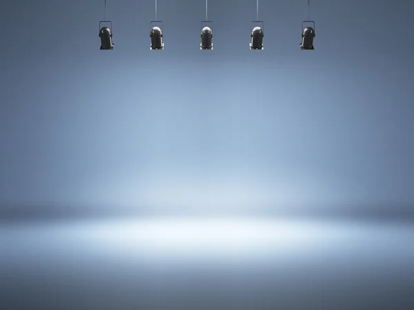 Blauwe spotlight achtergrond met lampen Stockfoto