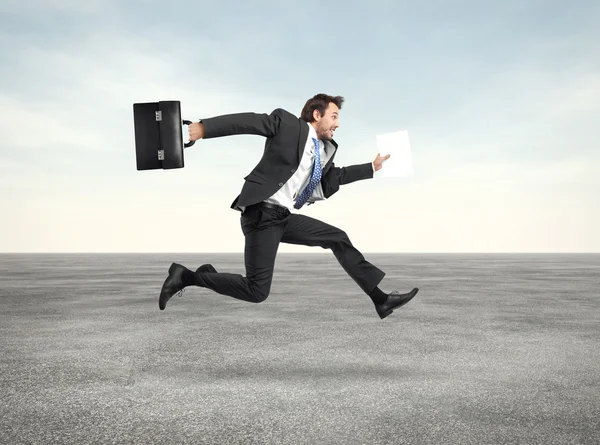 Businessman running with a briefcase — Stock Photo, Image