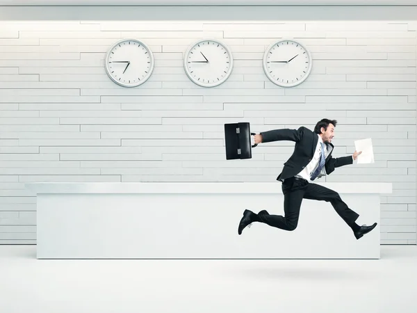 Businessman running with a briefcase — Stock Photo, Image