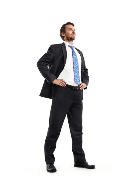 Full length of a business man with hands on hips — Stock Photo, Image