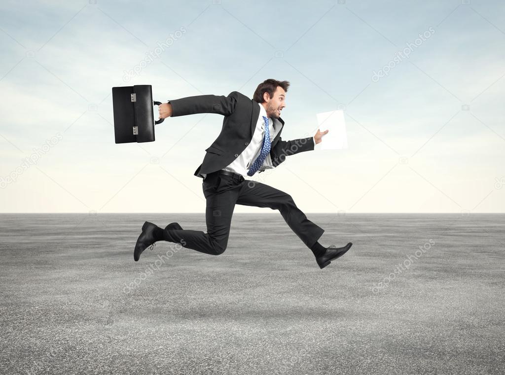 Businessman running with a briefcase