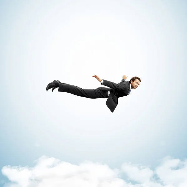 Businessman in the clouds — Stock Photo, Image