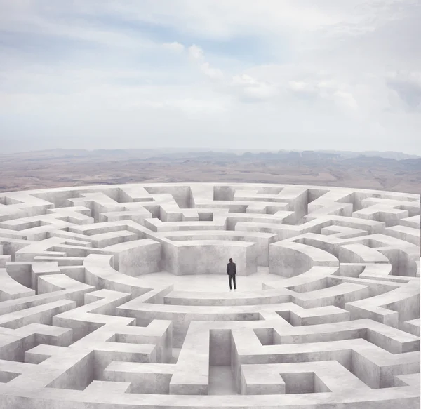 Businessman in the middle of a maze — Stock Photo, Image