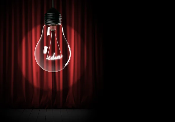 Rote Vorhänge und Glühbirne mit leuchtender Idee — Stockfoto