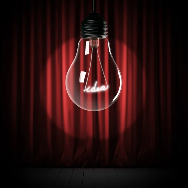 Красные занавески и лампочка с блестящей идеей — стоковое фото