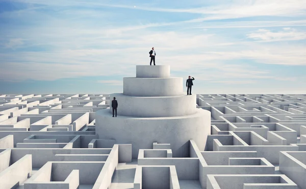 Businessmen in the middle of a labyrinth — Stock Photo, Image