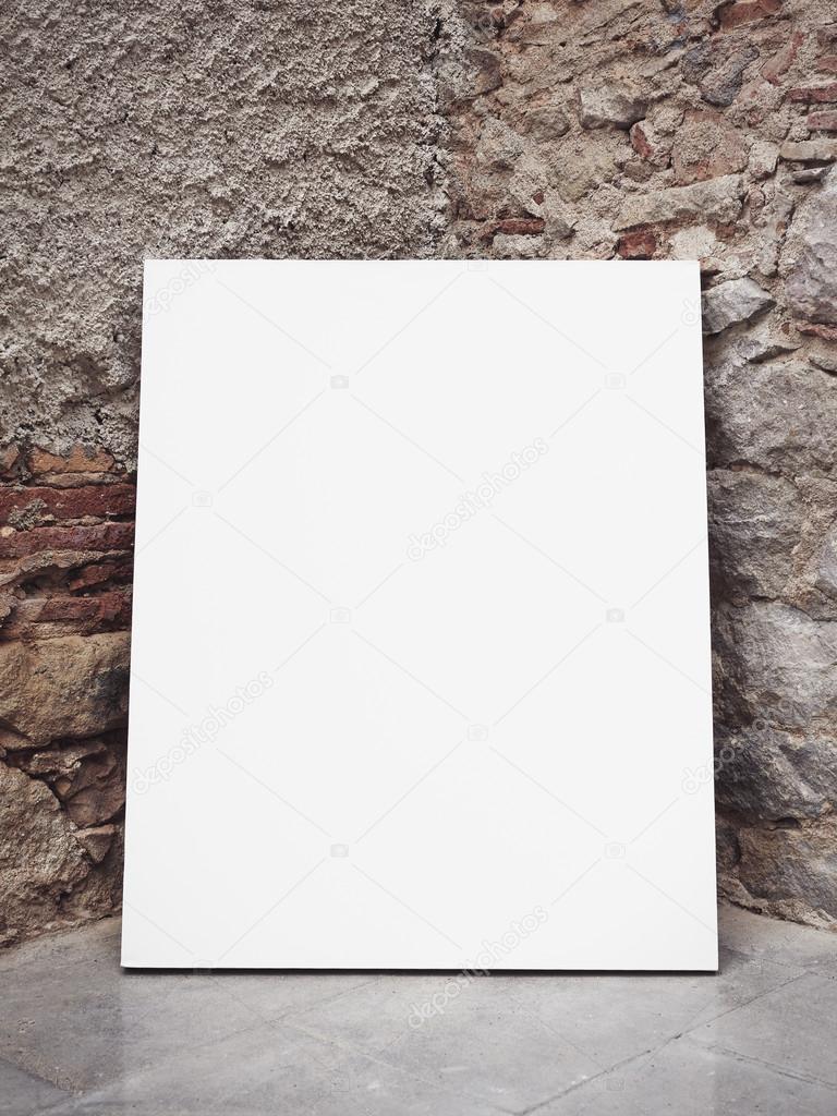 Brick wall and blank poster