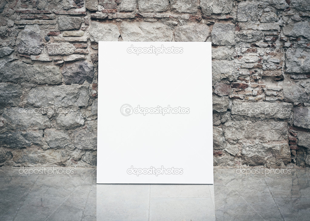 Old stone wall and blank poster