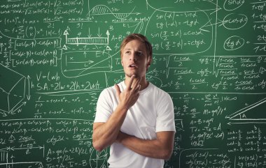 Portrait of young thinking man on mathematics background clipart