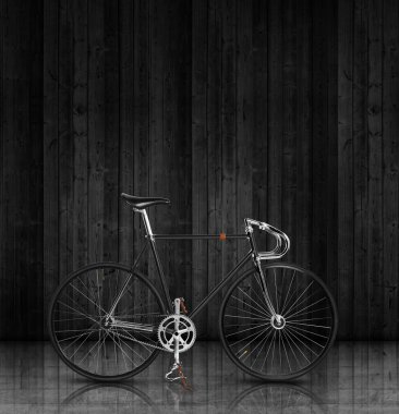 Bike over dark wall