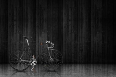 Bike over dark wall