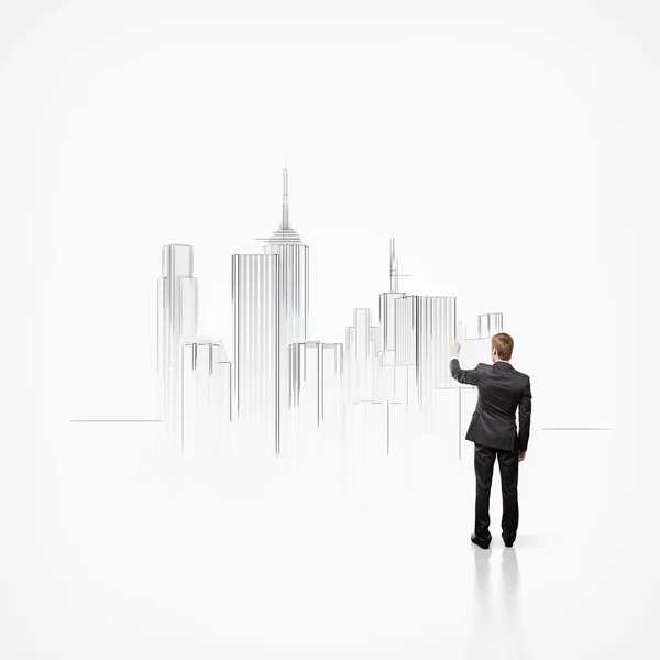 Businessman and model of a city — Stock Photo, Image