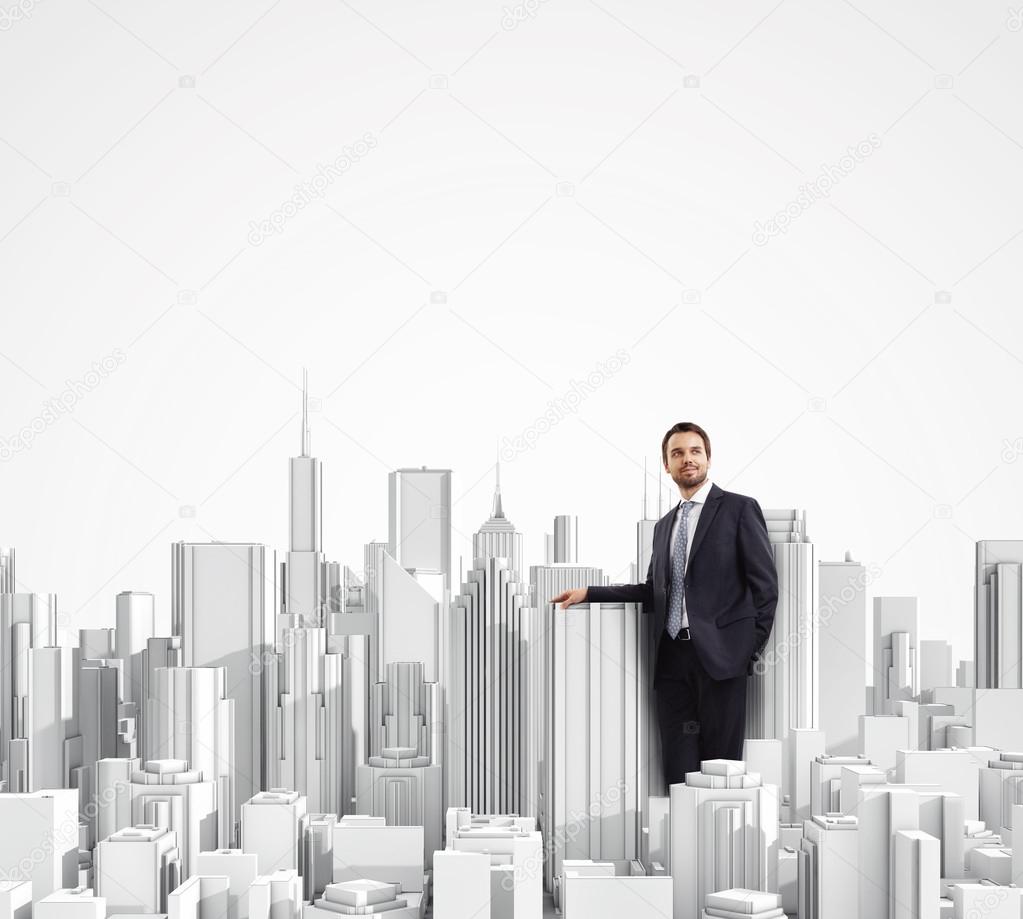 Businessman and model of a city