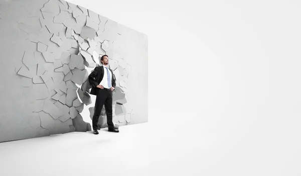 Businessman over wall — Stock Photo, Image