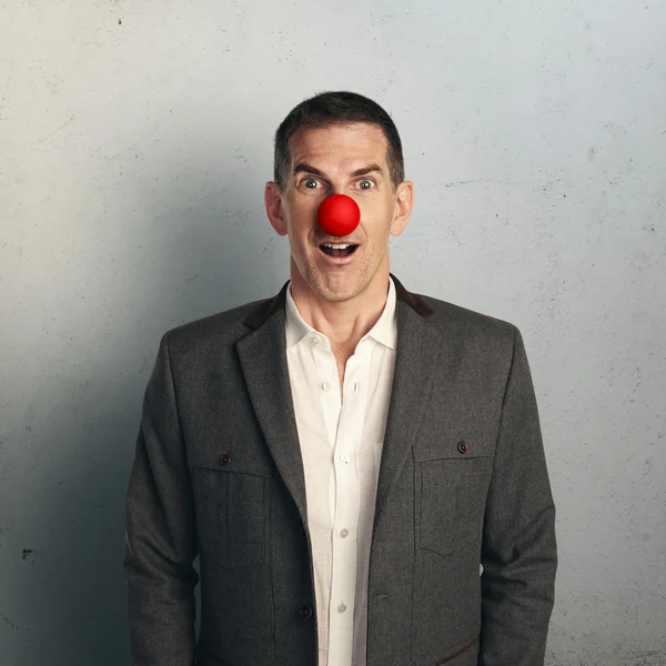 Businessman with red nose — Stock Photo, Image