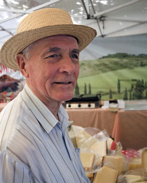 Senior at cheese market — Stock Photo, Image