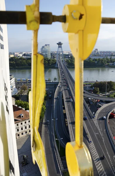 The top view of the Most SNP bridge in Bratislava through the clock hands — Stock Photo, Image