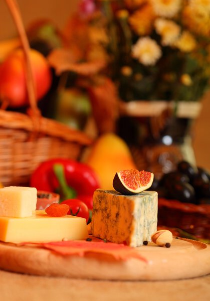 Cheese and fruits still life