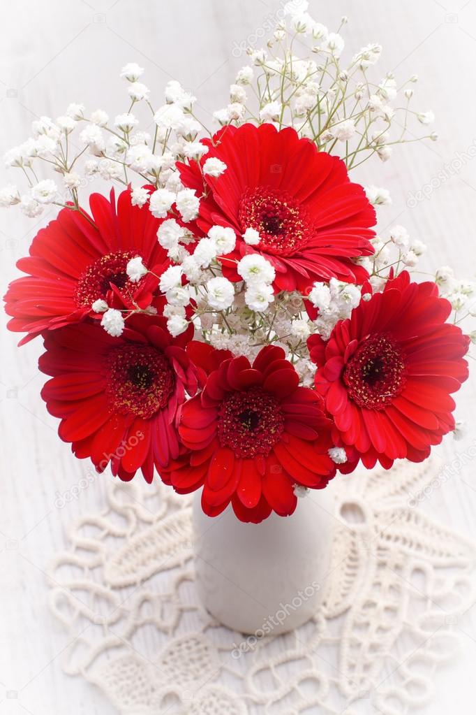 Red gerbera flowers in vase