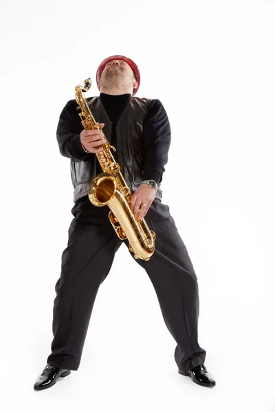 Saksofonisti harjaksen kanssa — kuvapankkivalokuva