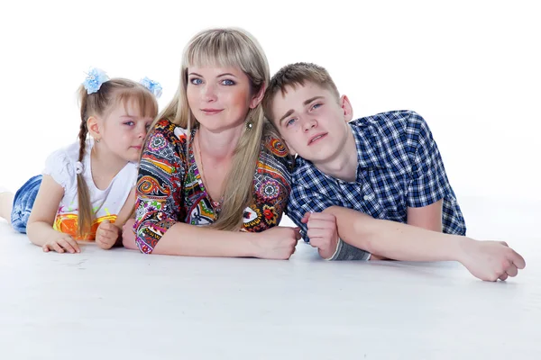 Portrait of happy mother and her children lying, sitting, playin — Stock Photo, Image