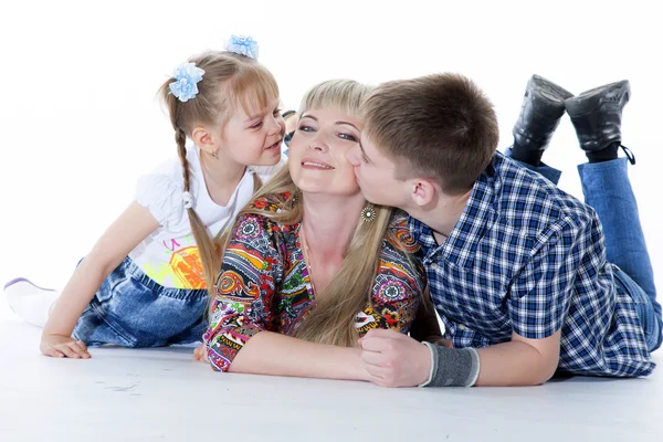 Portrait of happy mother and her children lying, sitting, playin — Stock Photo, Image