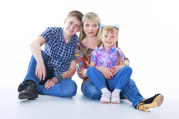 Portrait of happy mother and her children lying, sitting, playin — Stock Photo, Image