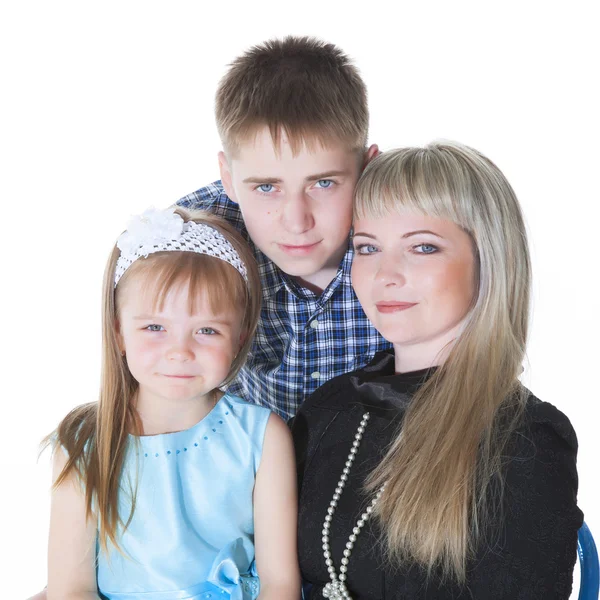 Portrait of happy mother and her children lying, sitting, playin Stock Picture