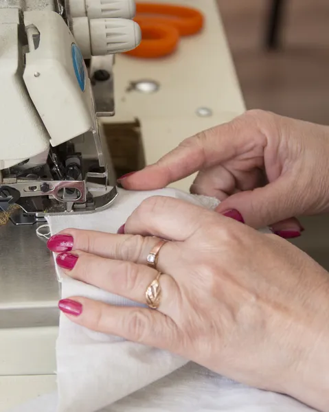 Hand sewing on a machine — Stock Photo, Image