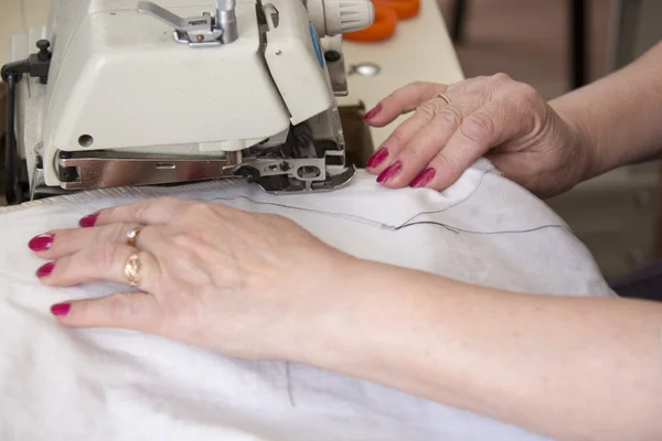 Hand sewing on a machine — Stock Photo, Image