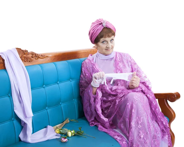 Woman sitting on the sofa — Stock Photo, Image