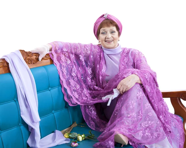 Woman sitting on the sofa — Stock Photo, Image