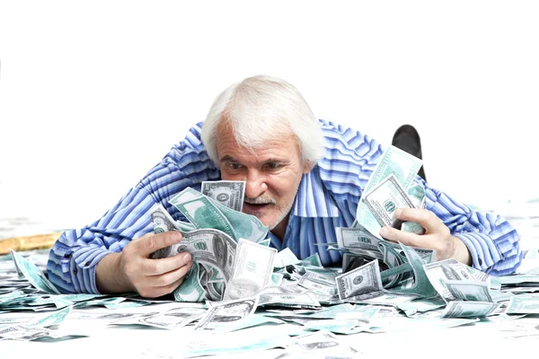 Man liggen in het geld — Stockfoto