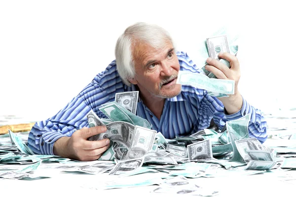 Homem deitado no dinheiro — Fotografia de Stock