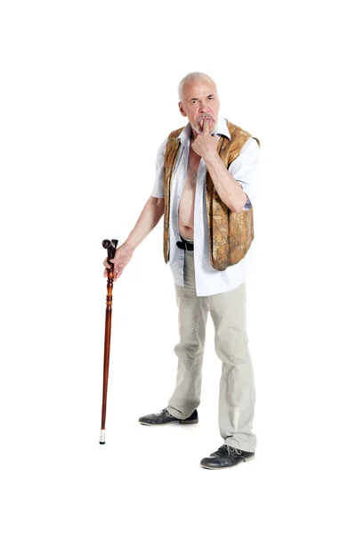 Man with a cane holds his finger in the mouth — Stock Photo, Image