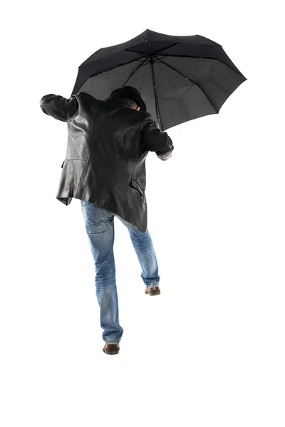 Homem com guarda-chuva preto andando sobre um fundo branco — Fotografia de Stock